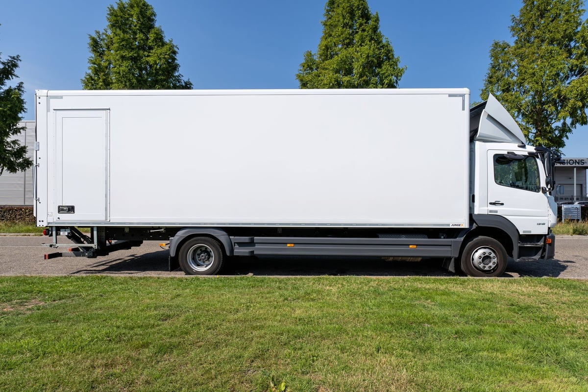 White Mercedes-Benz Atego cab-over truck, European flat-nose delivery truck